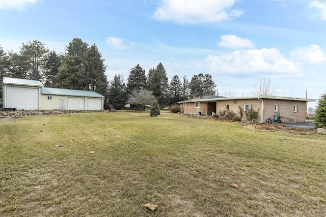view of yard with a garage