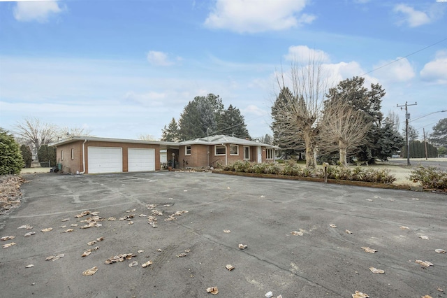 single story home featuring a garage