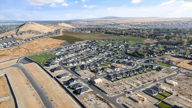 birds eye view of property with a mountain view