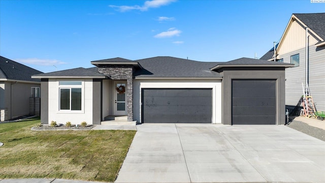 prairie-style house with a garage and a front yard