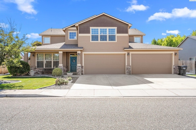 view of front facade featuring a garage and a front lawn