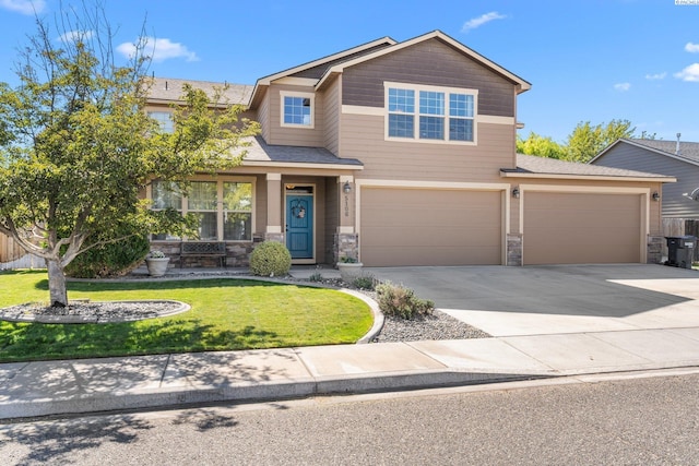 craftsman-style house featuring a garage and a front lawn