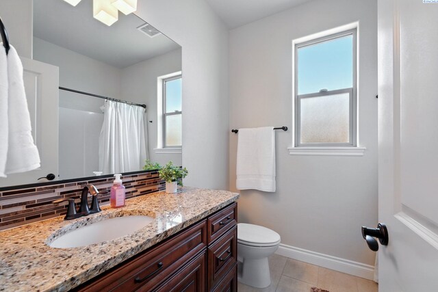 full bathroom featuring vanity, tasteful backsplash, toilet, baseboards, and tile patterned flooring