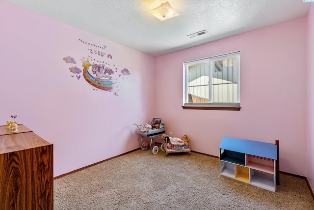 627 N Williams St, Kennewick, WA 99336 - rec room featuring carpet floors and a textured ceiling
