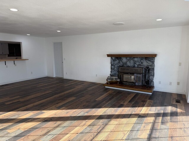 unfurnished living room with dark hardwood / wood-style flooring