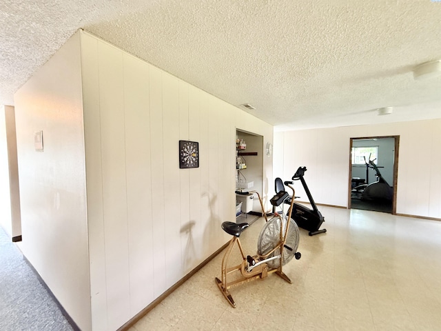2912 W Hood Ave Unit D104, Kennewick, WA 99336 - workout room featuring a textured ceiling