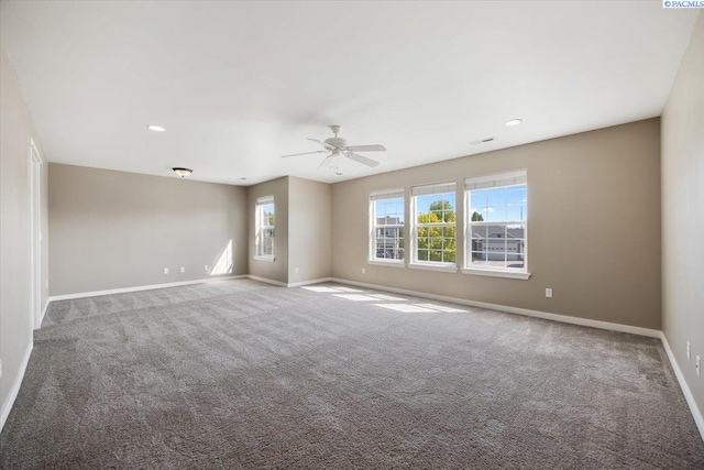 carpeted empty room with a ceiling fan, recessed lighting, and baseboards