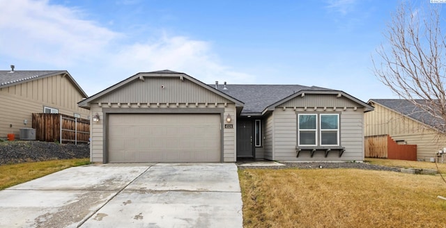 ranch-style house with a garage, central AC, fence, concrete driveway, and a front lawn