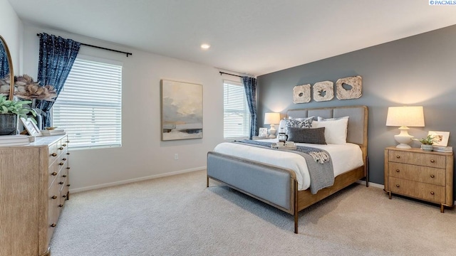 bedroom with light carpet