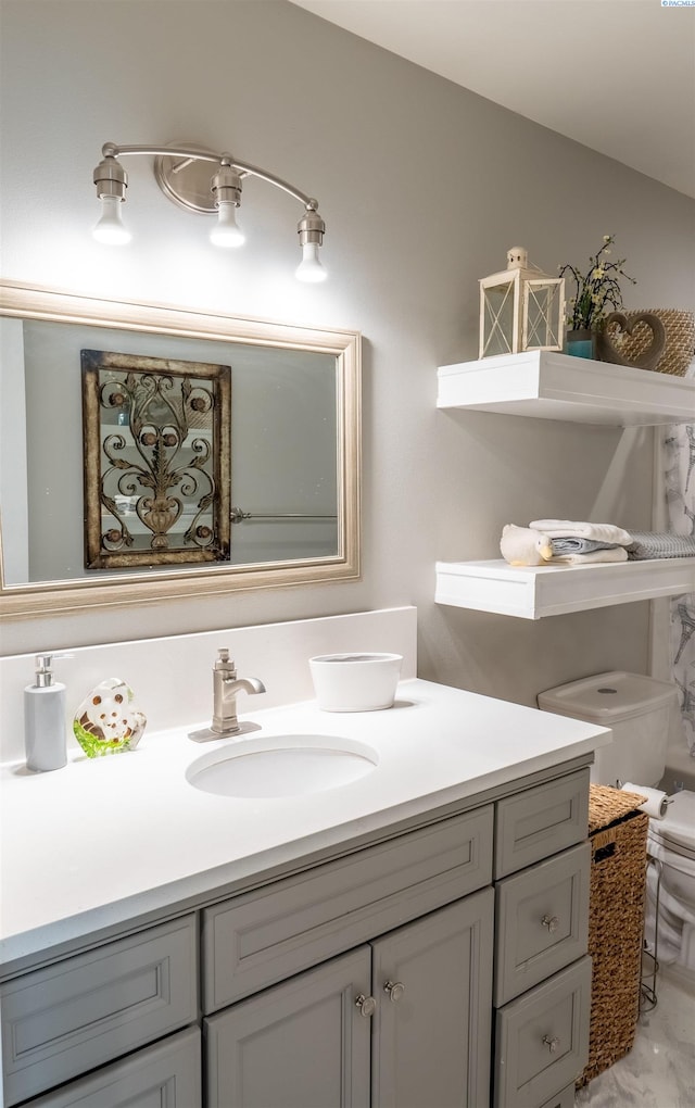 bathroom with vanity and toilet