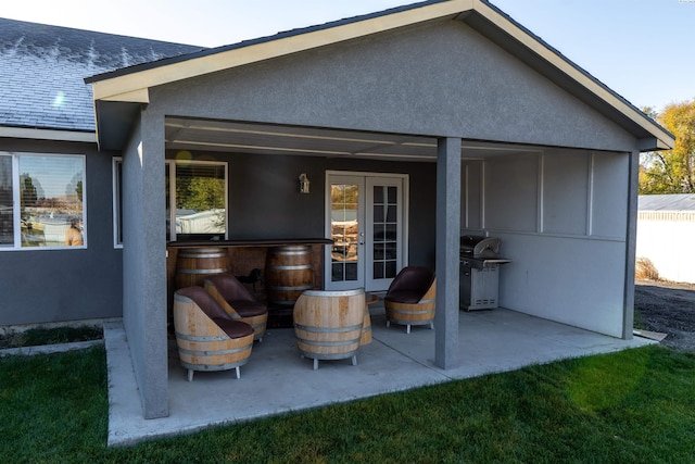 back of property featuring a patio area and french doors