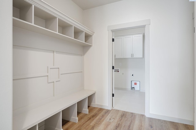 mudroom with light wood-type flooring and baseboards