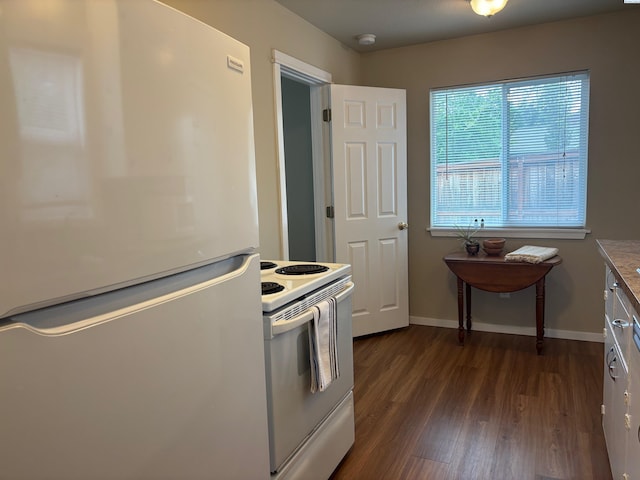 1320 NE Harvey Rd, Pullman, WA 99163 - kitchen with white appliances, dark wood-type flooring, and baseboards