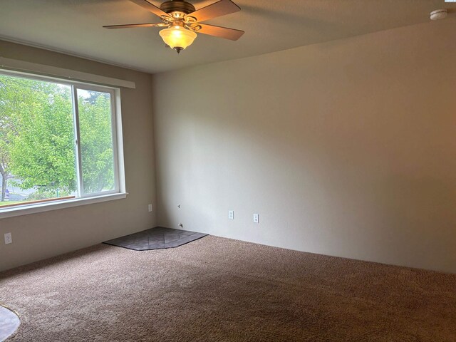 1320 NE Harvey Rd, Pullman, WA 99163 - carpeted empty room with a smoke detector and a ceiling fan