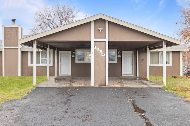 bungalow featuring a carport