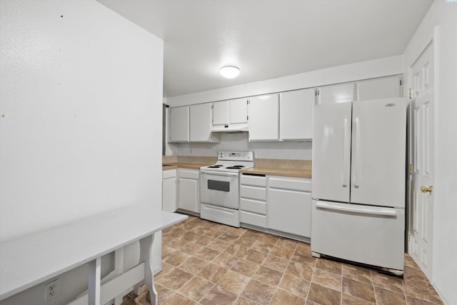 kitchen featuring white appliances and white cabinets