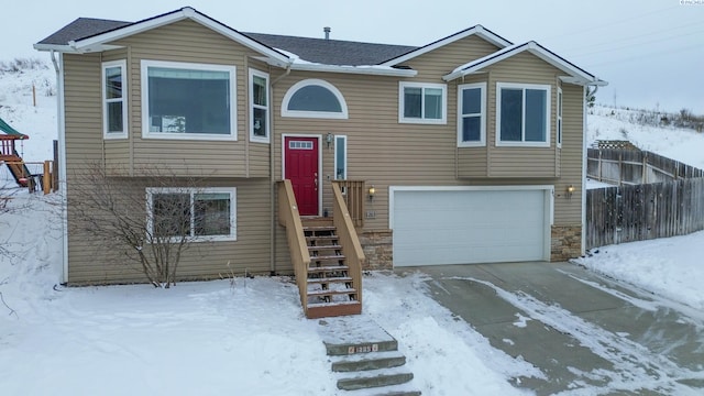 split foyer home featuring a garage