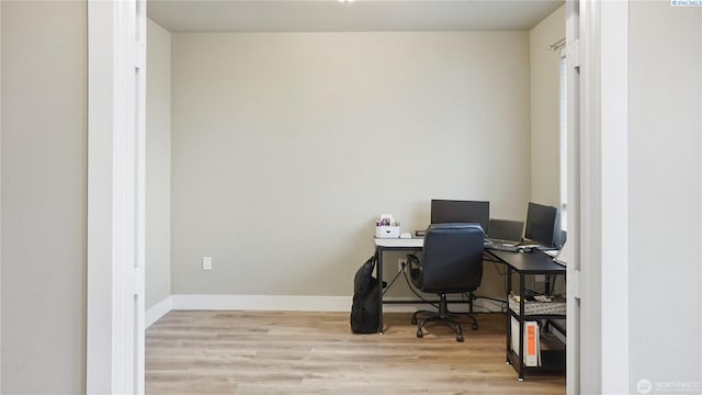 home office with light wood-type flooring