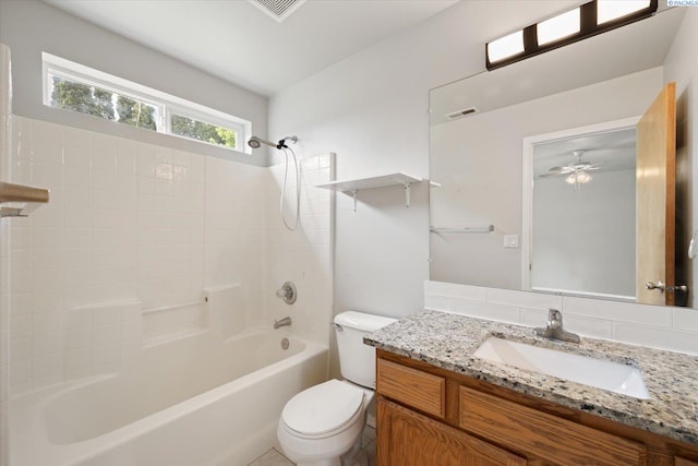bathroom with vanity, shower / bathtub combination, toilet, a ceiling fan, and visible vents