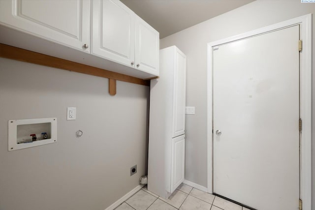 laundry area with washer hookup, hookup for an electric dryer, cabinet space, light tile patterned floors, and baseboards