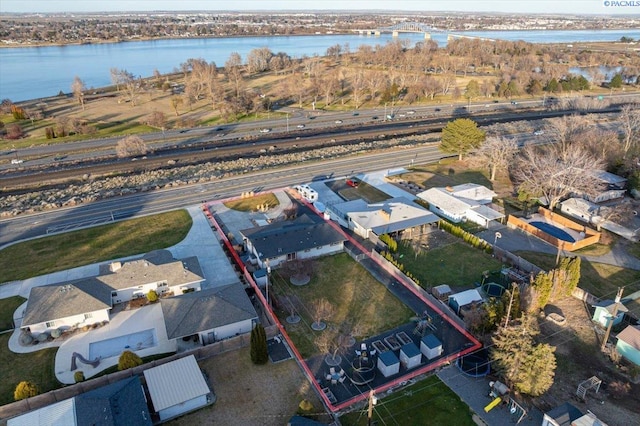 drone / aerial view featuring a water view and a residential view