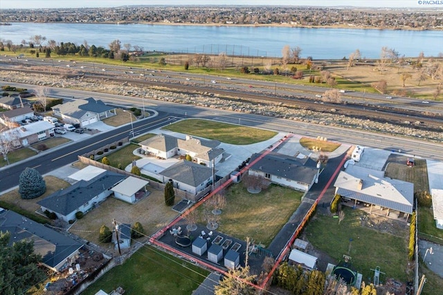 bird's eye view with a residential view and a water view