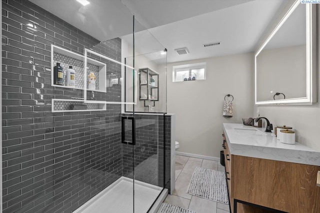 full bath featuring a stall shower, visible vents, vanity, and toilet