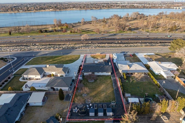 birds eye view of property featuring a water view and a residential view