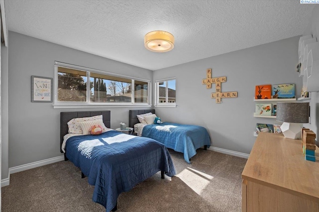 carpeted bedroom featuring a textured ceiling and baseboards