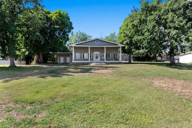 view of front of house with a porch and a front yard