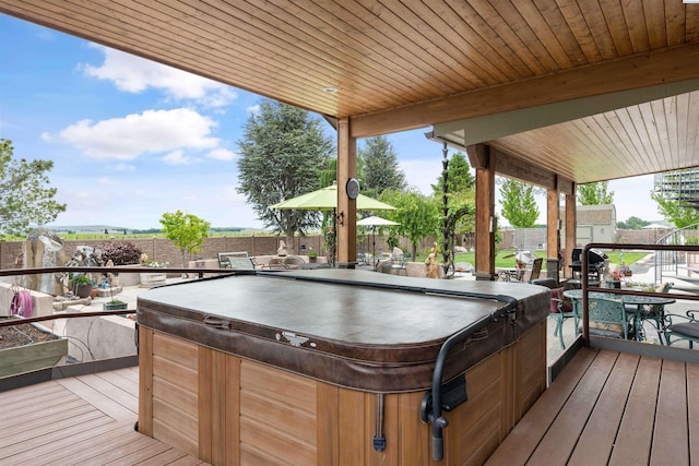 wooden terrace with a hot tub