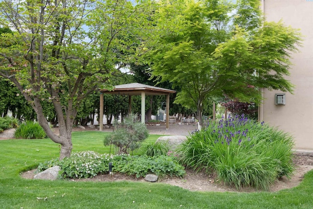 view of community with a gazebo and a yard