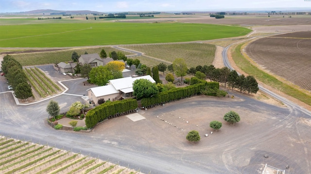 birds eye view of property with a rural view