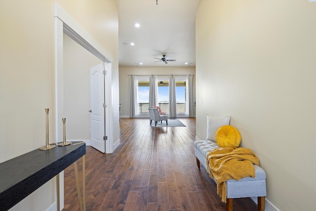 hallway with dark hardwood / wood-style flooring