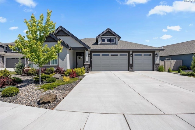 3149 Wild Canyon Way, Richland, WA 99354 - view of front of property featuring stone siding, a garage, concrete driveway, and stucco siding