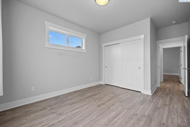 3149 Wild Canyon Way, Richland, WA 99354 - unfurnished bedroom with light wood-type flooring, a closet, and baseboards