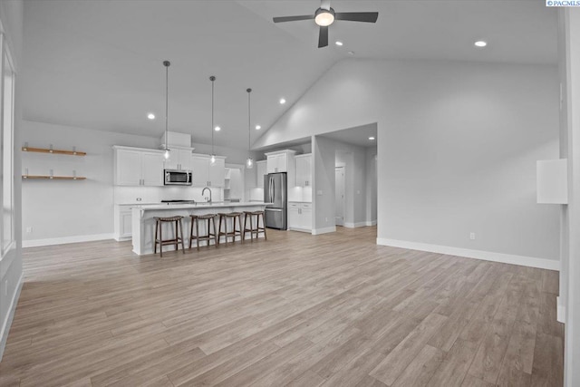 3149 Wild Canyon Way, Richland, WA 99354 - living area with ceiling fan, baseboards, high vaulted ceiling, light wood-style flooring, and recessed lighting