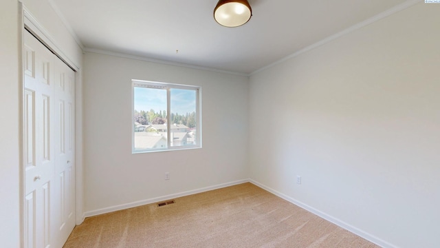 1220 SW Wadleigh Dr, Pullman, WA 99163 - unfurnished bedroom with a closet, light carpet, baseboards, and crown molding