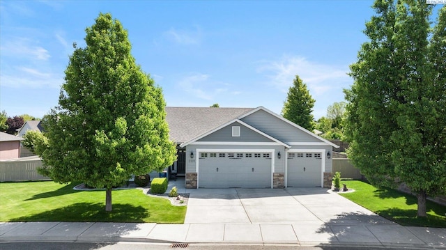 view of front facade with a garage and a front yard