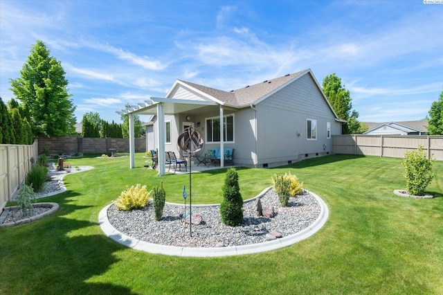 back of property with a patio area and a lawn