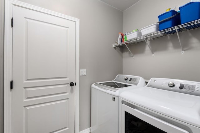 washroom with independent washer and dryer