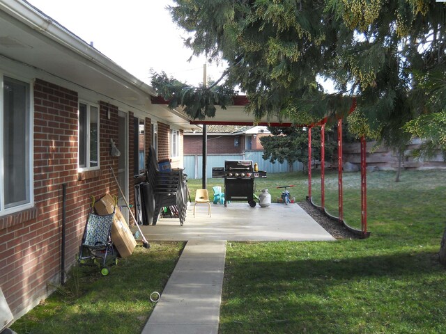 619 Grandview Ave, Sunnyside, WA 98944 - view of patio / terrace with fence and grilling area