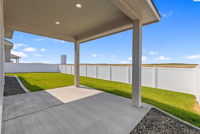 8801 Dusty Maiden Dr, Pasco, WA 99301 - fenced backyard featuring a patio area