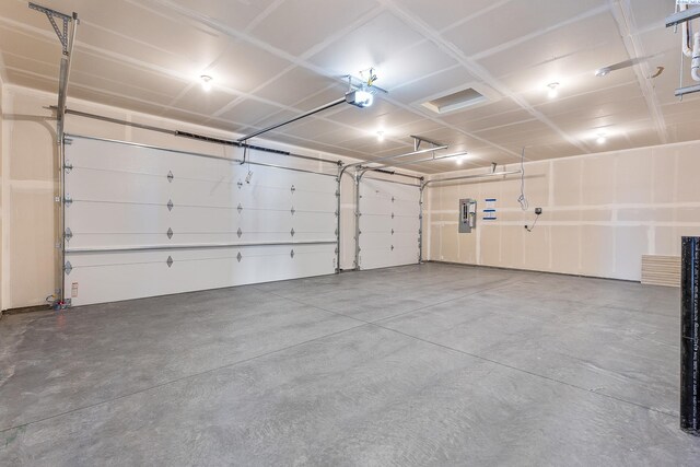 8801 Dusty Maiden Dr, Pasco, WA 99301 - garage featuring a garage door opener and electric panel