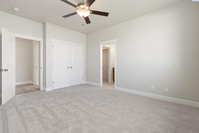 8801 Dusty Maiden Dr, Pasco, WA 99301 - unfurnished bedroom with light carpet, a closet, and a ceiling fan