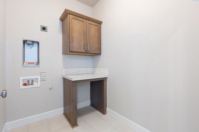 8801 Dusty Maiden Dr, Pasco, WA 99301 - laundry room featuring cabinet space, hookup for an electric dryer, washer hookup, and hookup for a gas dryer