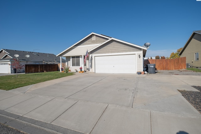 single story home with a garage and a front yard