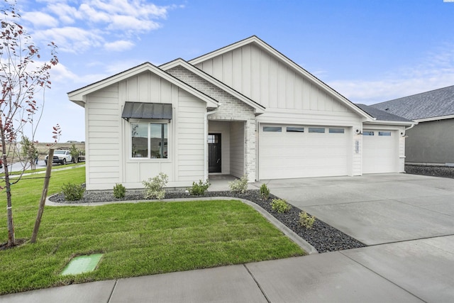 view of front of house with a garage and a front yard