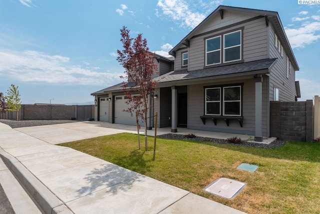 view of front of house featuring a garage, a front lawn, and a porch