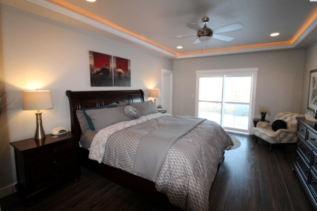 bedroom featuring recessed lighting, a raised ceiling, ceiling fan, and wood finished floors